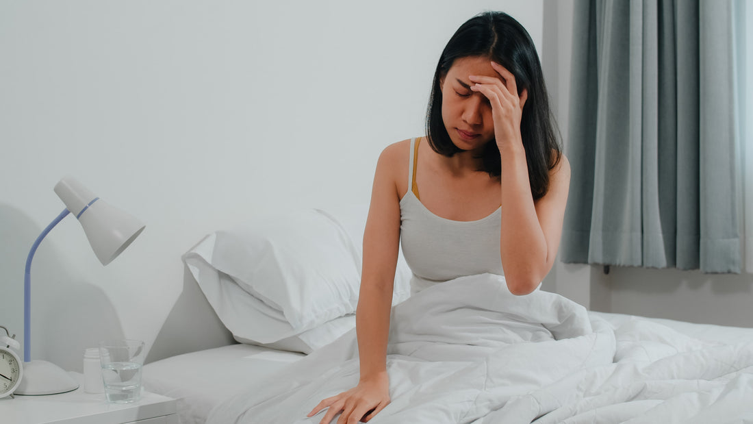 A woman suffering from insomnia looks tired and upset